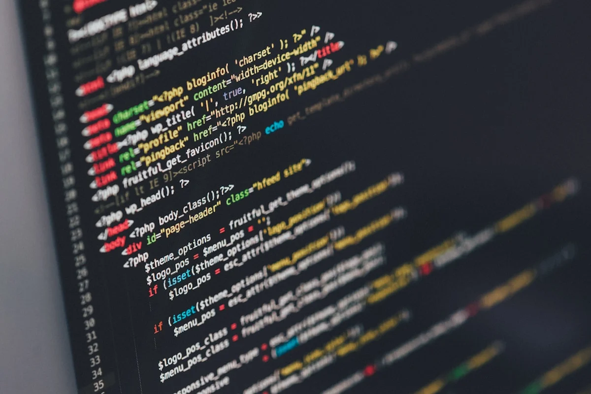 Code on a monitor in a dark room